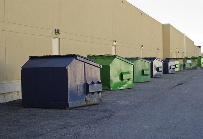 construction dumpsters on a worksite surrounded by caution tape in Algona, WA